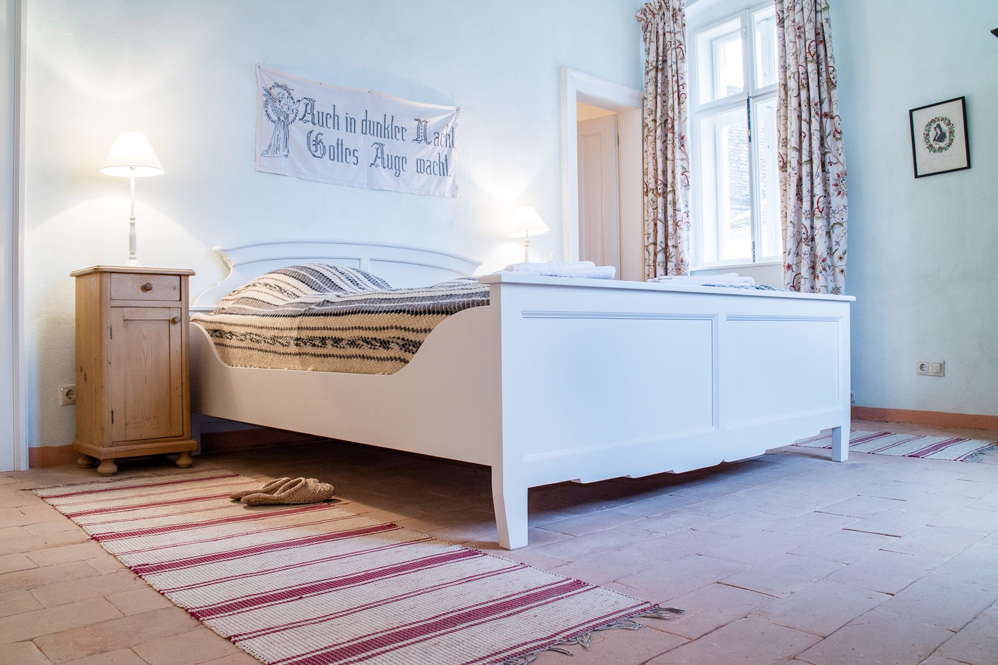 Authentic Saxon guesthouse bedroom in Richiș, part of our fully supported cultural cycling experience in Transylvania 📸 by MET - Mihai Eminescu Trust