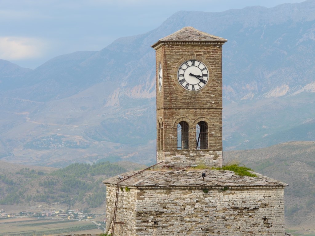 In Albania, you can expect history and wild terrain to meet, with mountain ranges framing towns like Gjirokastër.