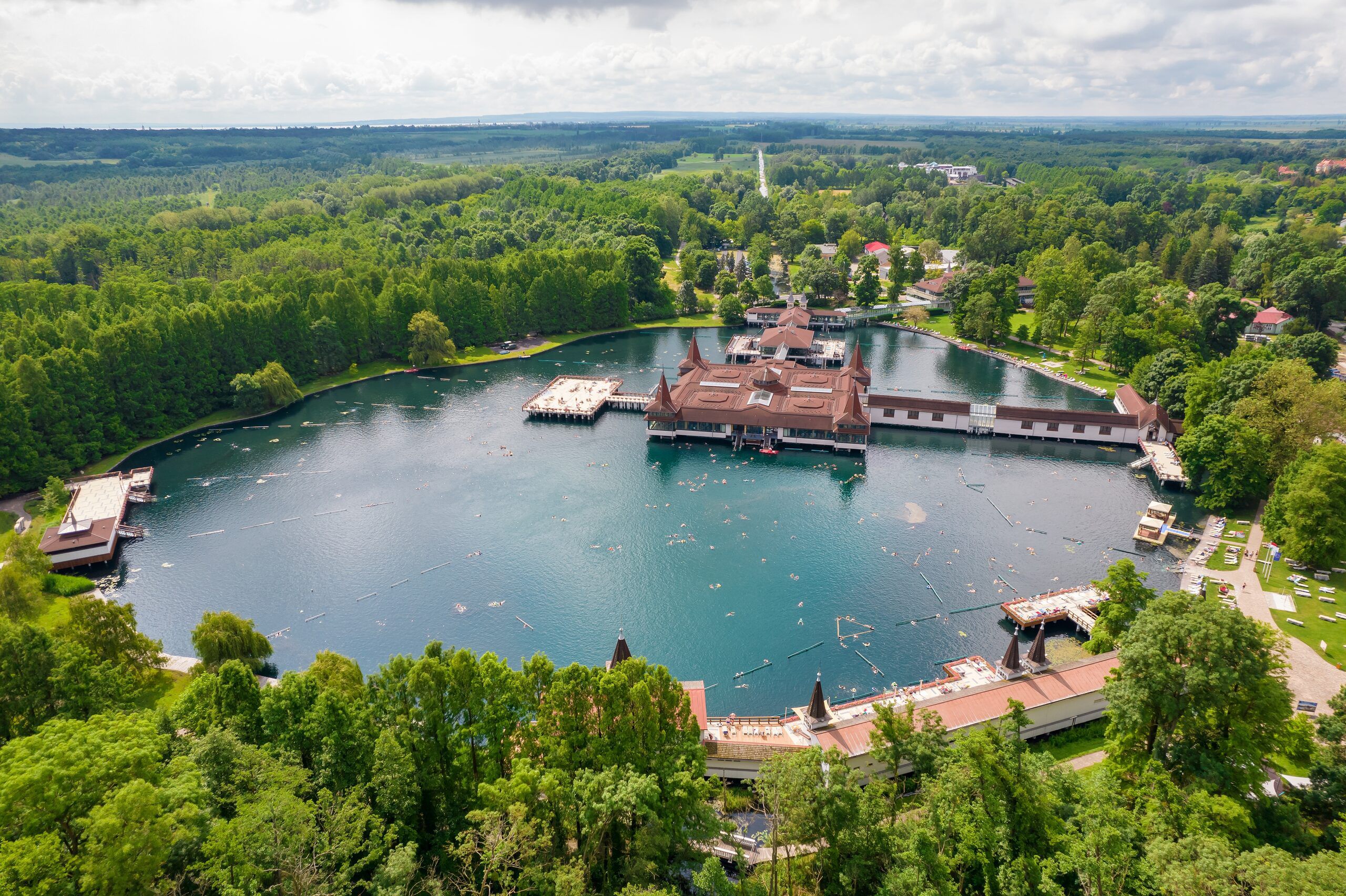 Aerial view of the thermal lake at Hévíz surrounded by forest
