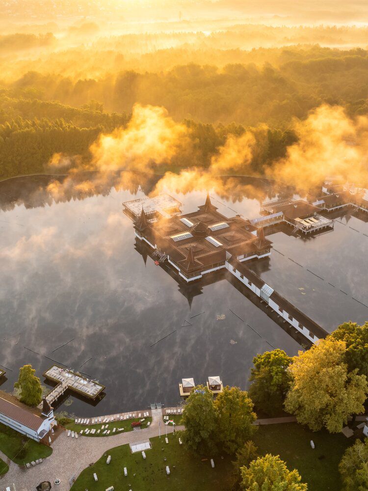 Steam rising off the thermal lake at Hévíz at sunrise