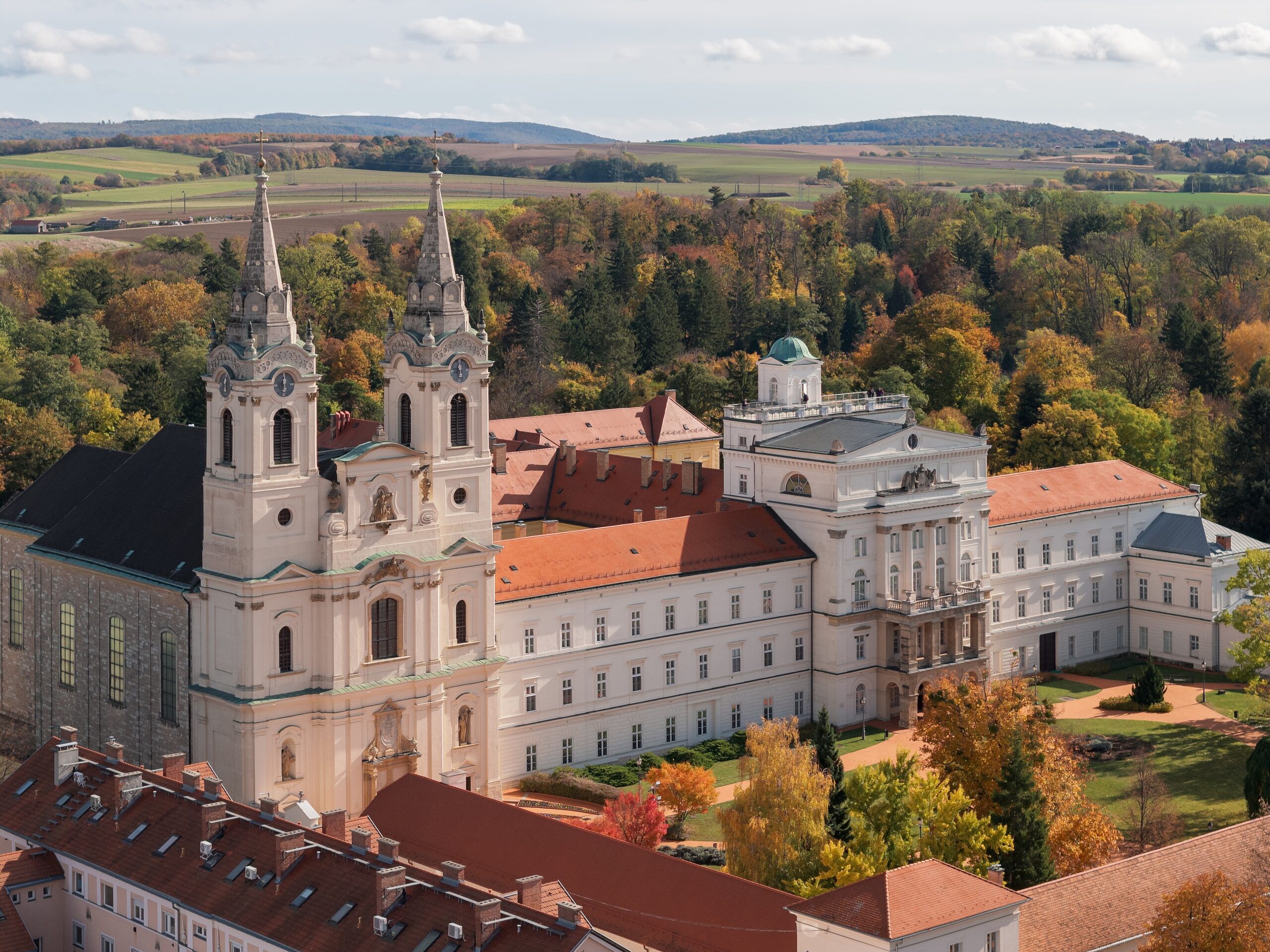 The twin towers of the Cistercian abbey at Zirc seen from above in autumn